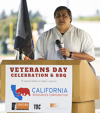 Photo of speaker at lecturn