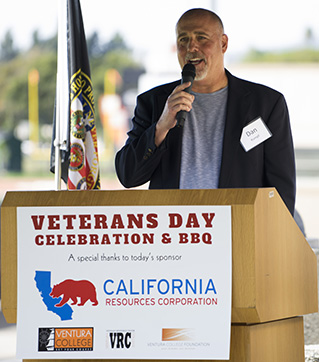 Photo of speaker at lecturn