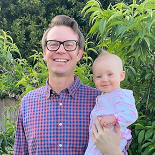 phillip briggs holding a baby
